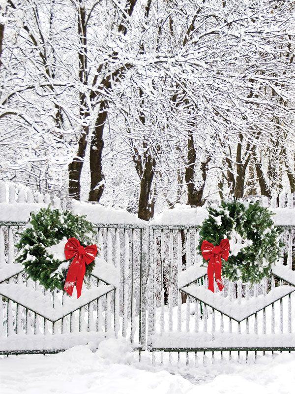 Snowy Wreath Adorned Gate Photography Backdrop - Snowy gate photography backdrop with wreaths and red bows, ideal for holiday photoshoots.