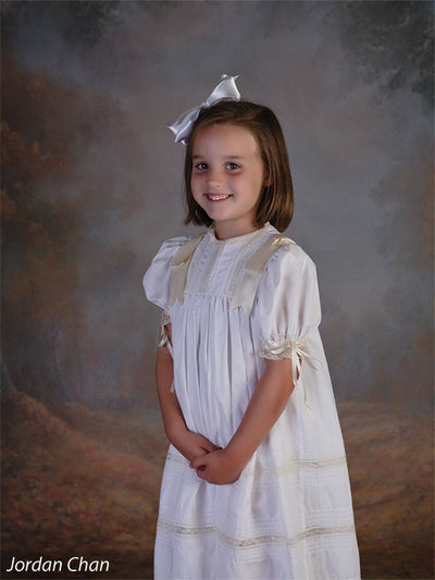 A smooth blend of fog, foliage, and tree trunks for timeless portraits.