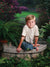 A professional photography backdrop capturing a peaceful Southern garden with a scenic path, blooming flowers, and natural greenery.