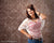 Teen girl poses confidently in front of an aged gold damask backdrop with distressed texture—ideal for senior portraits, school photography, and traditional full-length studio portraits.