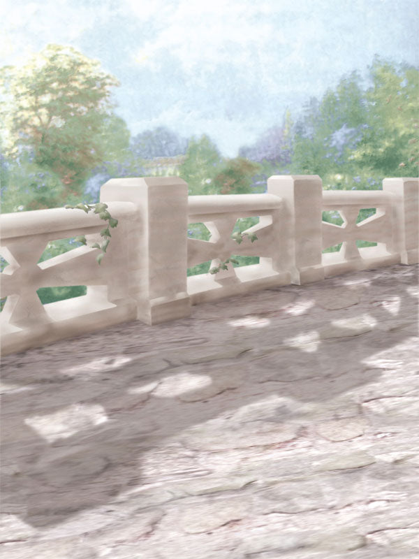 A soft, sunlit stone pathway photography backdrop with a classic balustrade and lush greenery, perfect for bridal and outdoor-inspired portrait sessions.