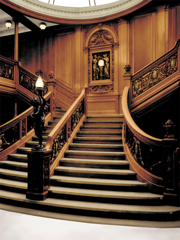 A stunning photography backdrop featuring the grand staircase of the Titanic with intricate woodwork and ornate details.
