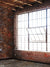 Urban Loft Brick Wall Photography Backdrop - Photography backdrop featuring an exposed brick wall with a large grid-patterned window for urban-themed photoshoots.