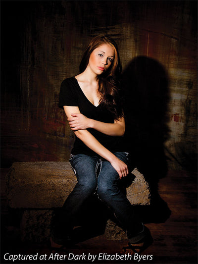Distressed red and black photography backdrop with vertical strokes.