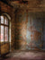 Empty room with cracked plaster and dramatic ambient light.