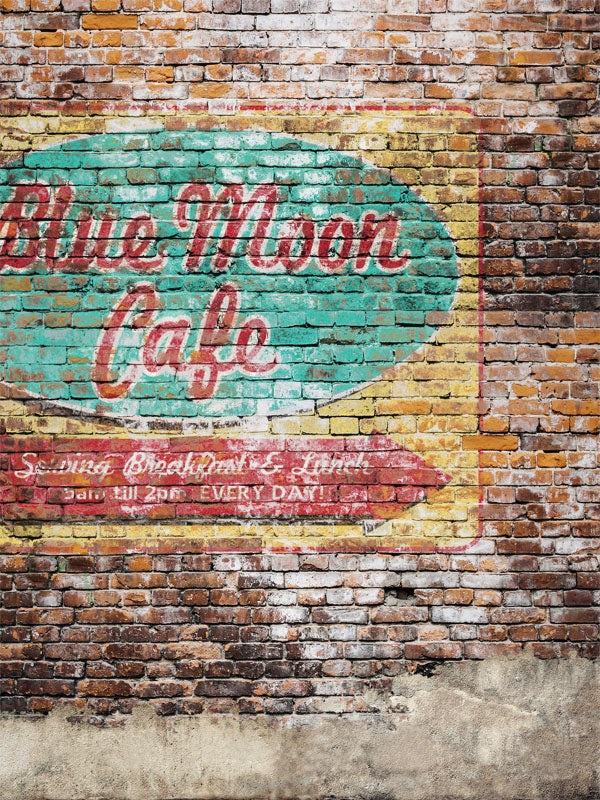 Vintage Café Brick Wall Photography Backdrop - A weathered brick wall backdrop featuring a vintage "Blue Moon Café" sign, perfect for urban and retro-themed photography.