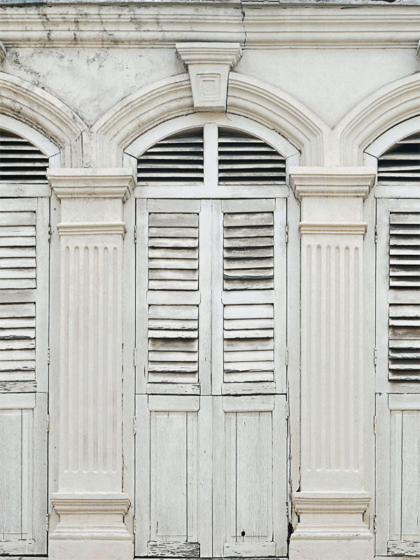 Vintage Colonial Shutter Photography Backdrop - A vintage colonial shutter photography backdrop with soft white and pale gray tones, featuring weathered wood shutters and stately columns.