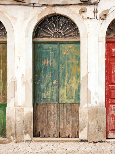 Vintage Distressed Door Photography Backdrop - Vintage distressed door photography backdrop featuring a weathered green door with rustic stone and wood, ideal for editorial and portrait photography.