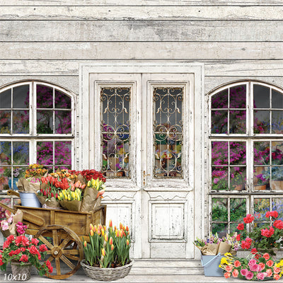 Vintage flower shop photography backdrop featuring an elegant weathered storefront with lush floral arrangements.