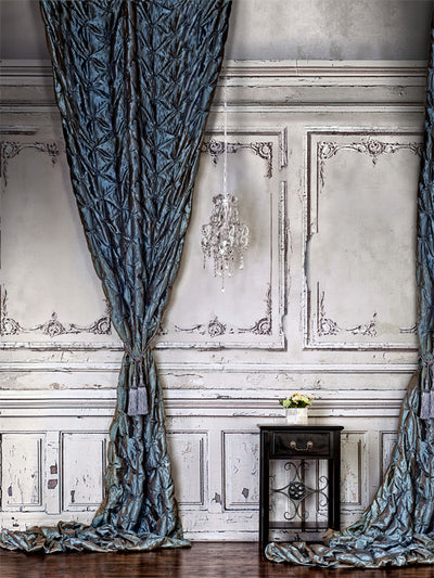 Vintage French Chateau Photography Backdrop - Vintage French interior photography backdrop with blue drapes, a chandelier, and a classic side table.