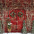 Photography backdrop featuring a rustic red barn door decorated with holiday wreaths and twinkling lights, perfect for winter portraits.