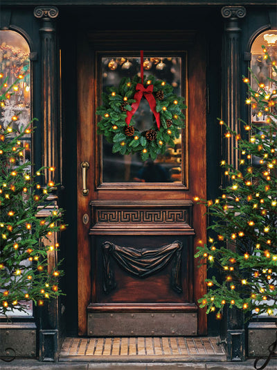 Vintage Holiday Doorway Photography Backdrop - Festive holiday photography backdrop featuring a vintage wooden doorway with a Christmas wreath and twinkling Christmas trees.