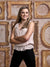 A vintage photography backdrop featuring an assortment of gilded, antique-style frames on a distressed beige wall, perfect for classic-themed photography.