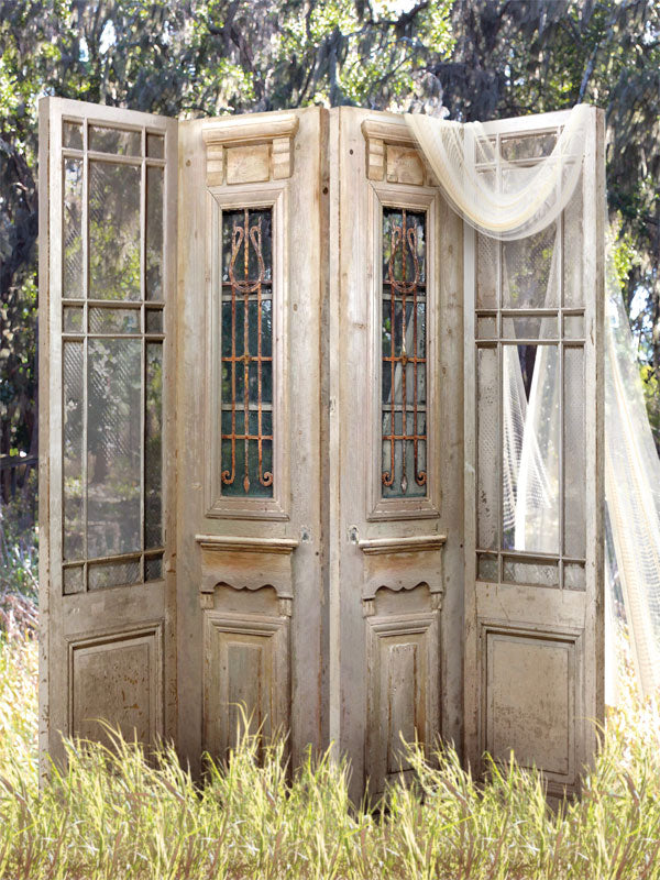 Vintage Rustic Garden Door Photography Backdrop - A vintage garden door photography backdrop featuring weathered wooden doors, wrought iron accents, and soft drapery, perfect for romantic and editorial photoshoots.