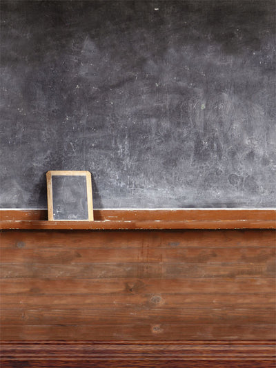 Classic blackboard-style photography backdrop with rustic wooden trim for professional photoshoots and vintage-themed settings.