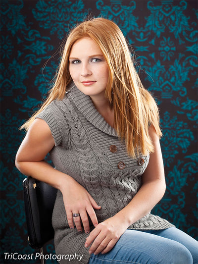 Timeless baroque-style pattern with a luxurious teal-on-black palette.