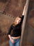A warm-toned backdrop showcasing weathered steel panels and visible rust patina.