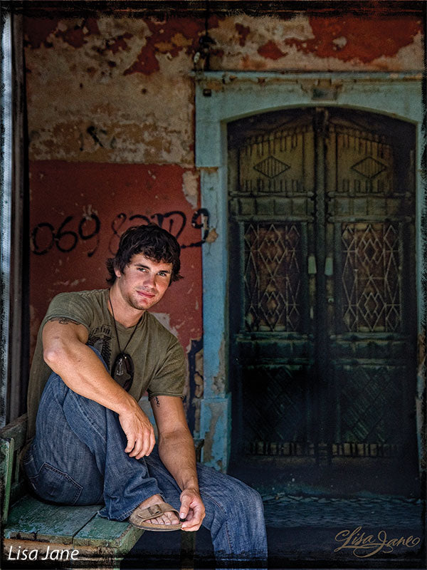 Features an aged red-and-cream wall with graffiti and a vintage double-door design.