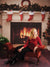 A festive Christmas scene featuring red stockings above a lit fireplace beside a sparkling tree and wood flooring.