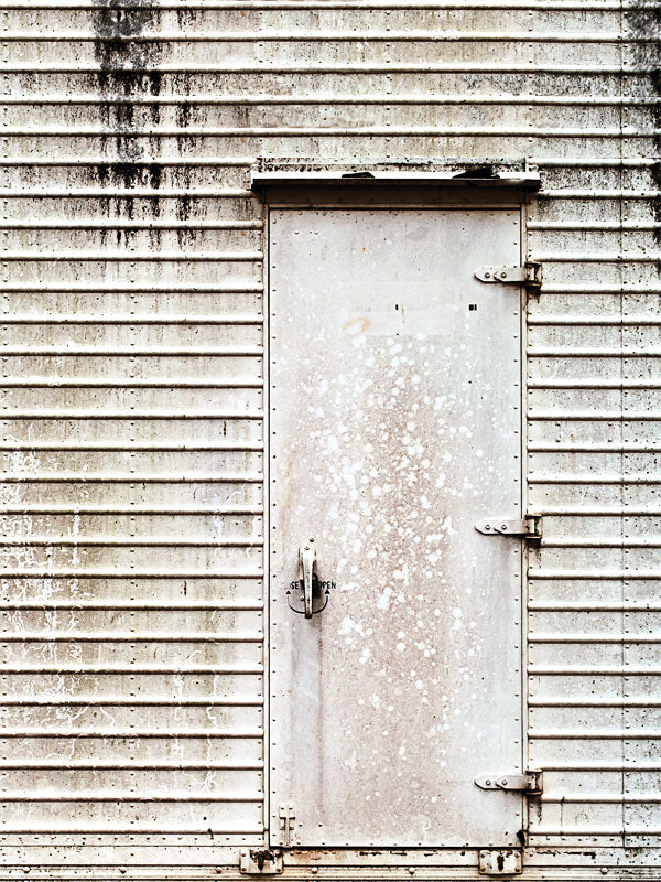 Weathered Industrial Door Photography Backdrop - A weathered, industrial-style door backdrop with rust and aging textures, ideal for professional photography.