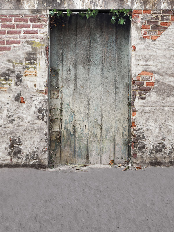 Aged brick and plaster wall with rustic texture for moody urban portraits.