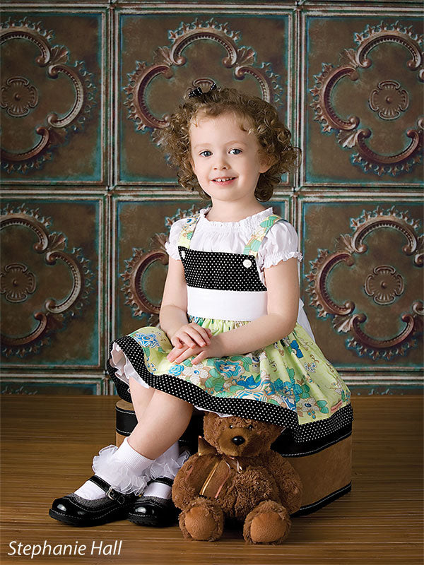 Backdrop showcasing a rustic patina finish and symmetrical design.