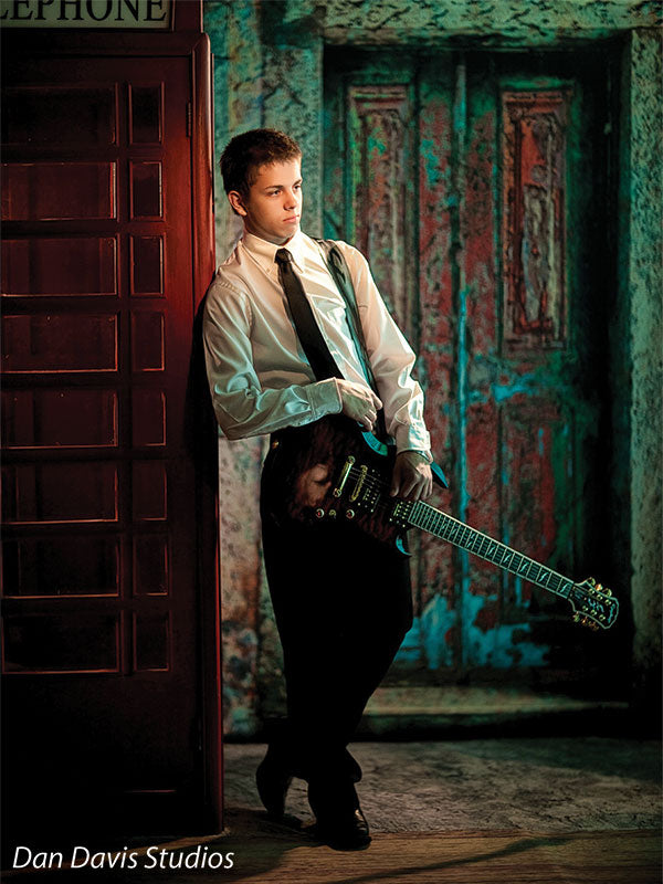 Turquoise door with layered paint and rustic age for creative portraits.