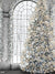 Winter Wonderland Christmas Tree Photography Backdrop - Snow-covered Christmas tree adorned with silver and gold ornaments in a winter wonderland setting.