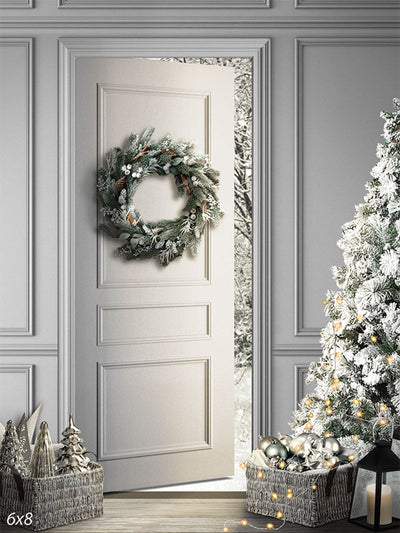 Winter Wonderland Door Photography Backdrop - A serene winter-themed photography backdrop with a white door, frosted wreath, snow-dusted Christmas tree, and festive ornaments.