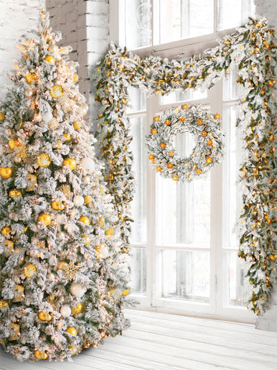 Winter Wonderland Gold Christmas Tree Photography Backdrop - Christmas photography backdrop with a frosted tree and gold ornaments, framed by snow-covered garlands and wreaths, perfect for holiday photos.