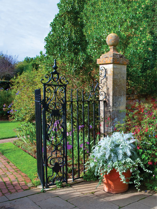 Wrought Iron Garden Gate Photography Backdrop - Photography backdrop featuring a classic wrought iron gate surrounded by lush greenery and flowers, ideal for garden-themed photoshoots.