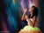 Creative portrait with a teen girl blowing bubbles against a vivid abstract backdrop inspired by celestial motion.