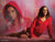 Senior girl with dual exposure effect posed in red hoodie on vibrant pink gift wrap-style photography backdrop.