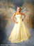 Young woman in elegant yellow dress against a classic European cityscape backdrop, perfect for prom, senior, or fashion portraits.