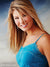 Female model in blue dress against European canal backdrop, adding charm and sophistication to portrait sessions.