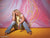 Senior girl sitting against vibrant pink ribbon-inspired backdrop, perfect for colorful portrait setups and teen photo shoots.