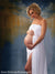Elegant maternity portrait featuring a soft golden European city backdrop, ideal for timeless and graceful studio imagery.