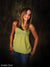Model stands before the Scrolled Photography Backdrop, emphasizing its vintage-style scroll detail and grunge finish suitable for school portraits.