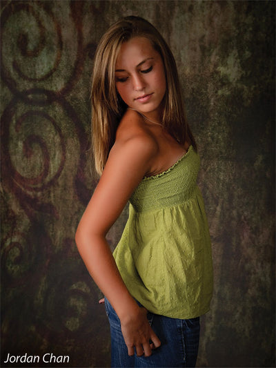 Teen model poses against the Scrolled Photography Backdrop, highlighting its painterly earth tones and vintage scroll design for styled senior portraits.