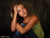 Teen model poses with soft lighting against the Scrolled Backdrop, showcasing its subdued scrollwork and painterly finish for expressive photography.