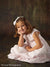 Model in a seated pose highlights the backdrop’s grunge finish and subtle scrolls, showing its versatility for soft and traditional children’s portraits.