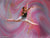 Dancer captured mid-jump in front of dynamic pink and pastel backdrop with swirling gold accents, designed for dance studio photography.